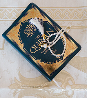 A Quran with prayer beads